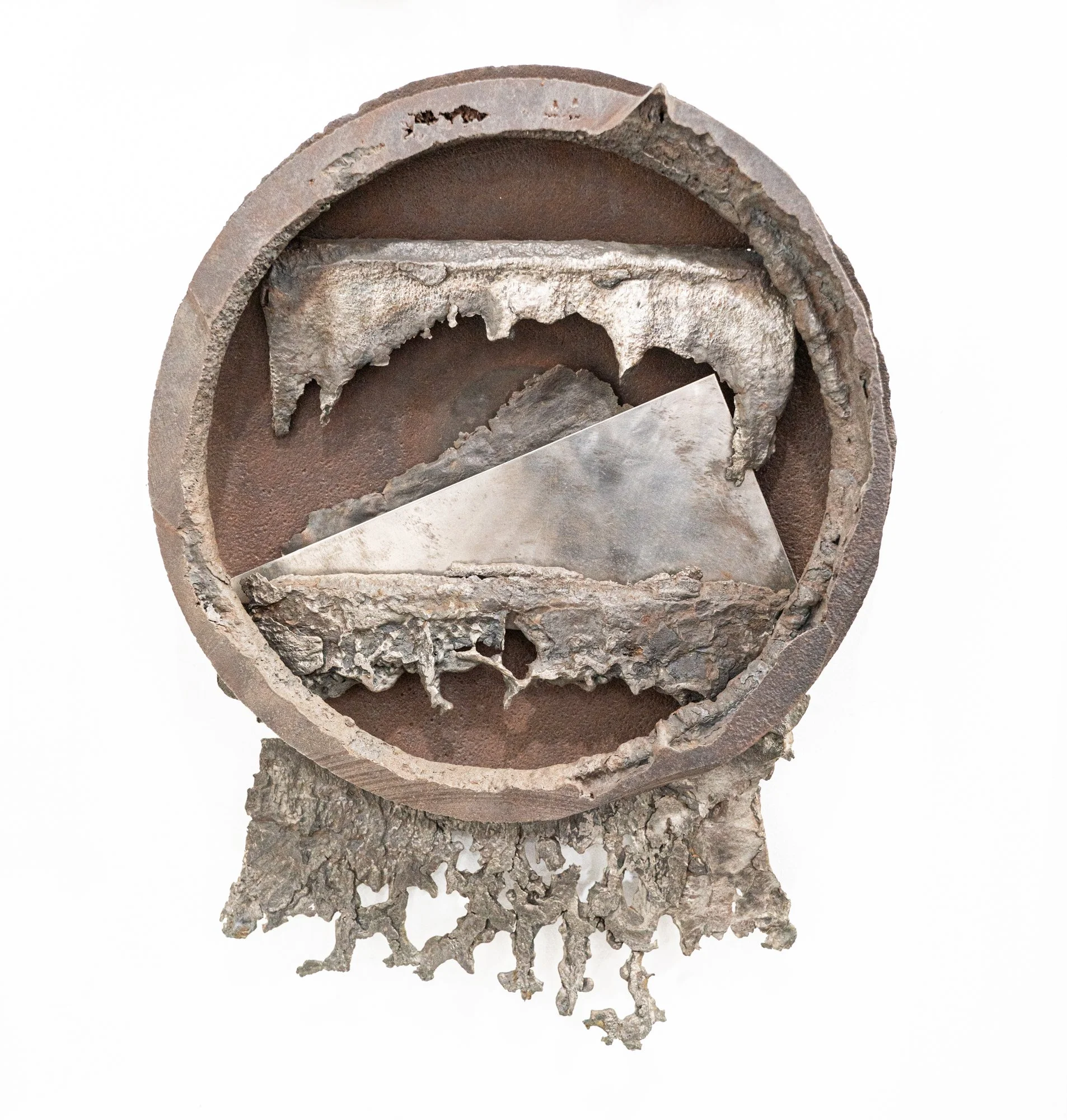 Plate Shift - Inspired by the shifting plates of the earth. Welded steel, cast stainless steel. 22” x 16.5” x 4” 1994