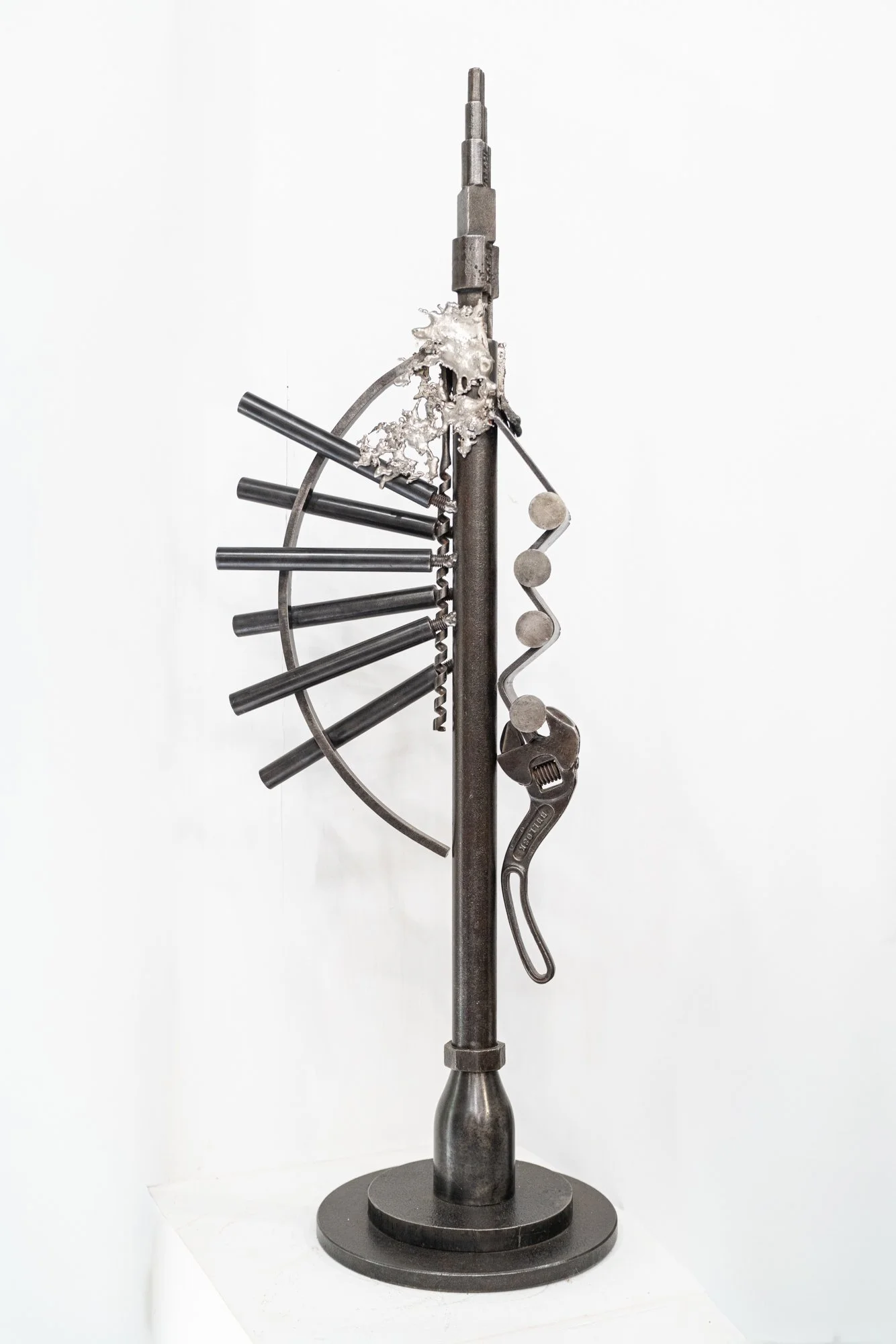 Connections - Inspired by the expressive nature of vintage tools. 41” x 14” x 8”. Vintage tools, cast stainless, welded steel. 1990