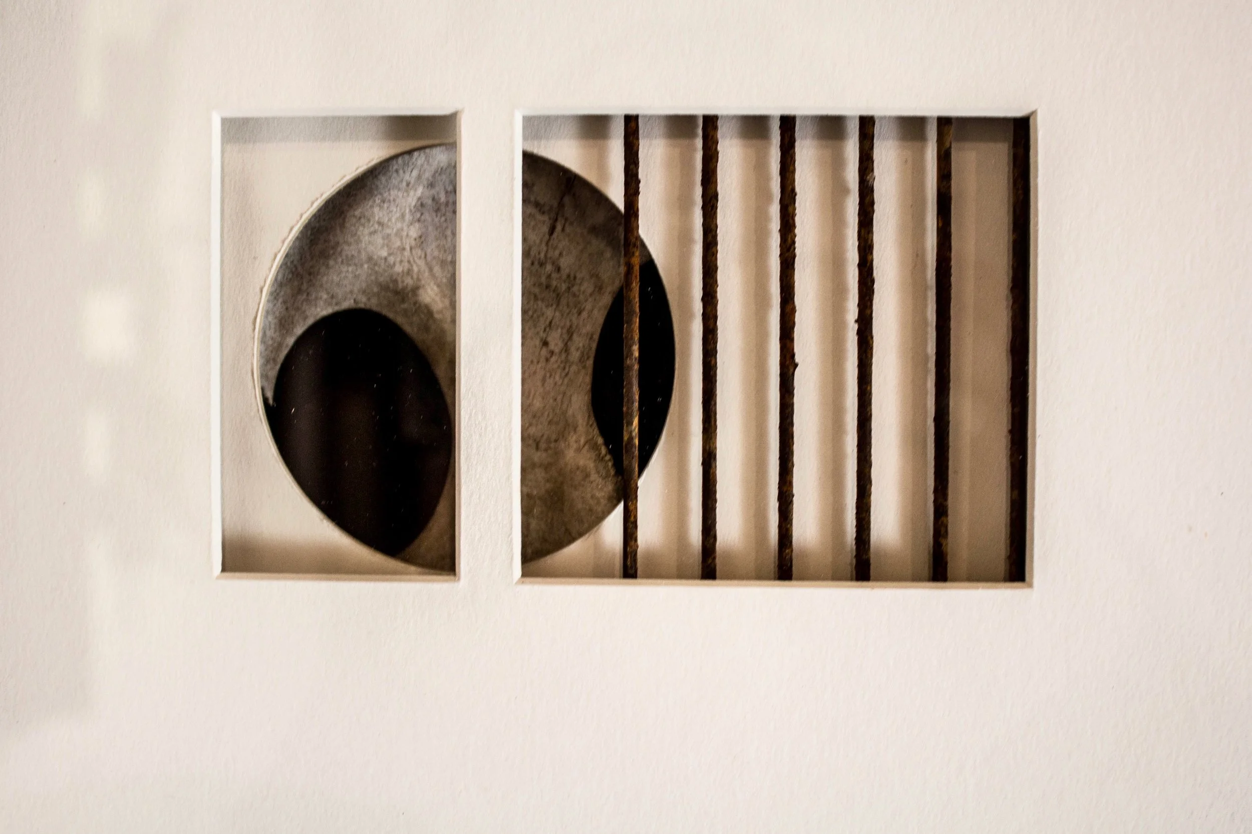 Spatial Opposition  - Concept of showing deep space within a confined frame using disparate objects. Cow bone, steel, matt board. 16” x 24” x 3” 1990. 
