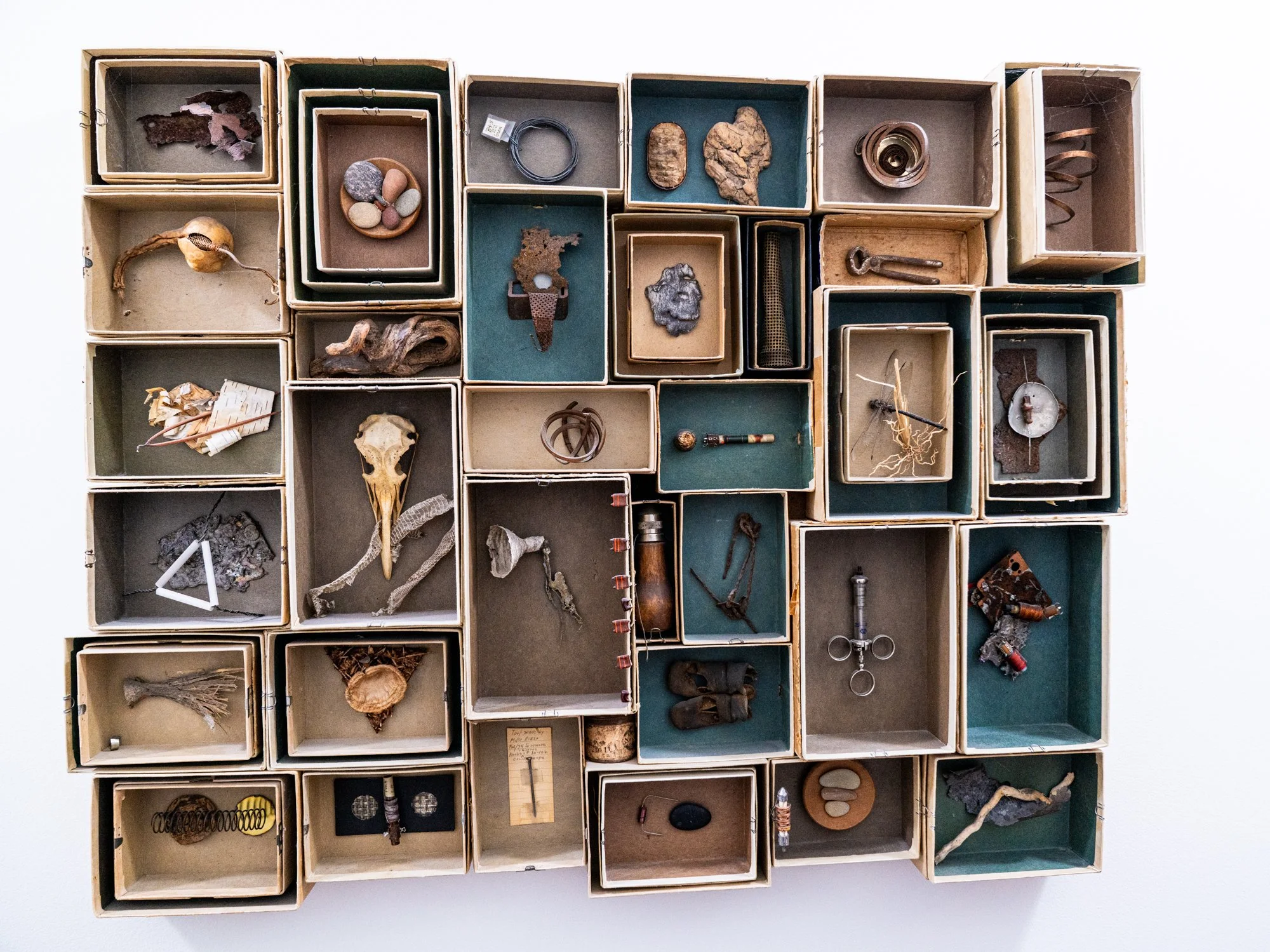 Confinement - This larger version of confinement draws inspiration from the sensation of being constrained, restricted, or hindered in movement, activity,or self-expression. Vintage mailing boxes, various items inside each box.( bird skull, steel, ru