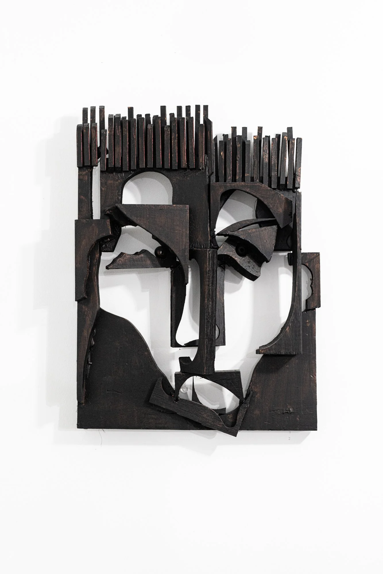 Open Face - Using scrap pieces of wood, this face emerged. Wood, 
16” x 10” x 3” 2010