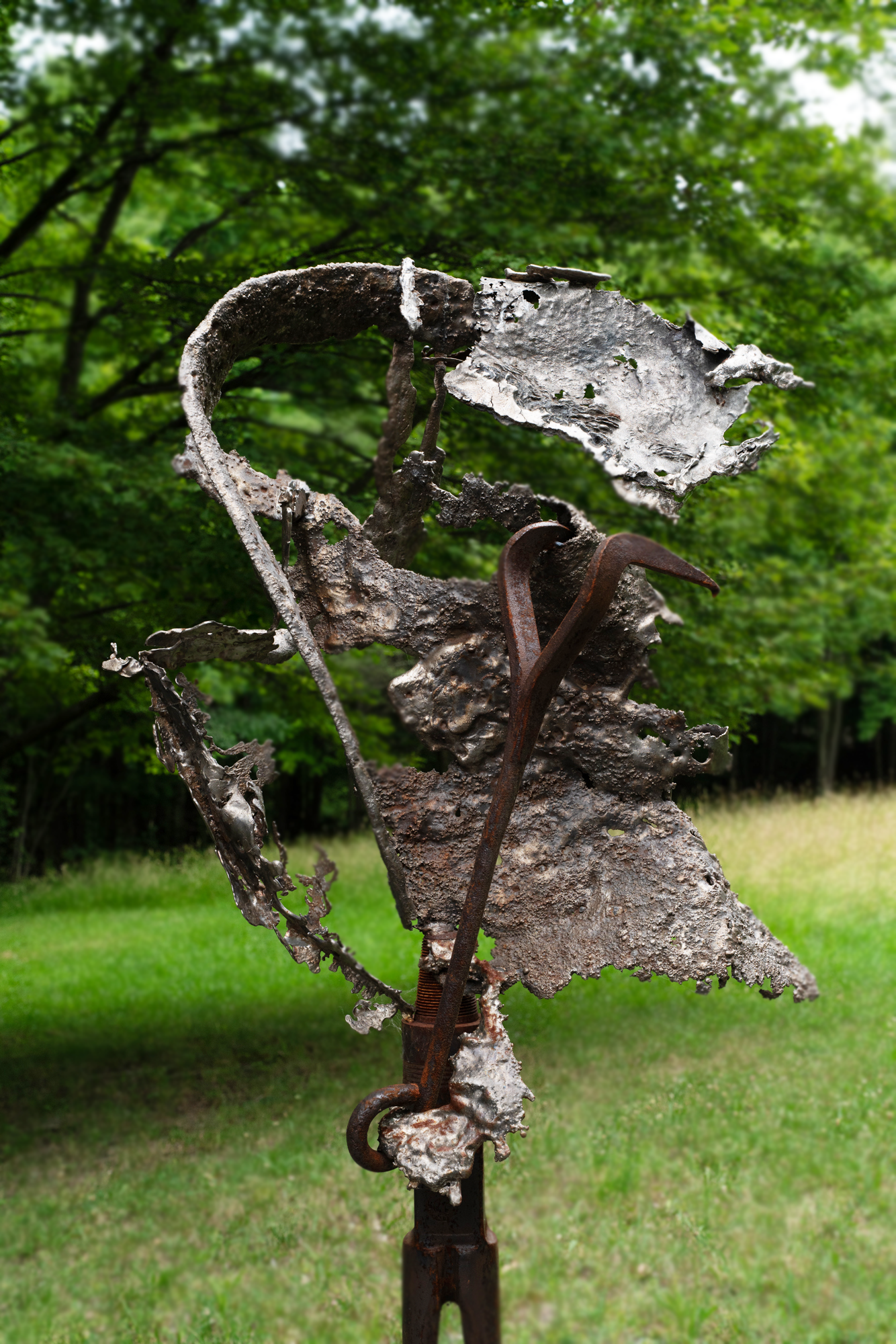 Torrential  - Inspired by the overwhelming intensity of wind and rain. Welded steel, cast stainless, vintage hooks and drill auger. 84” x 34” x 34”. 2022
