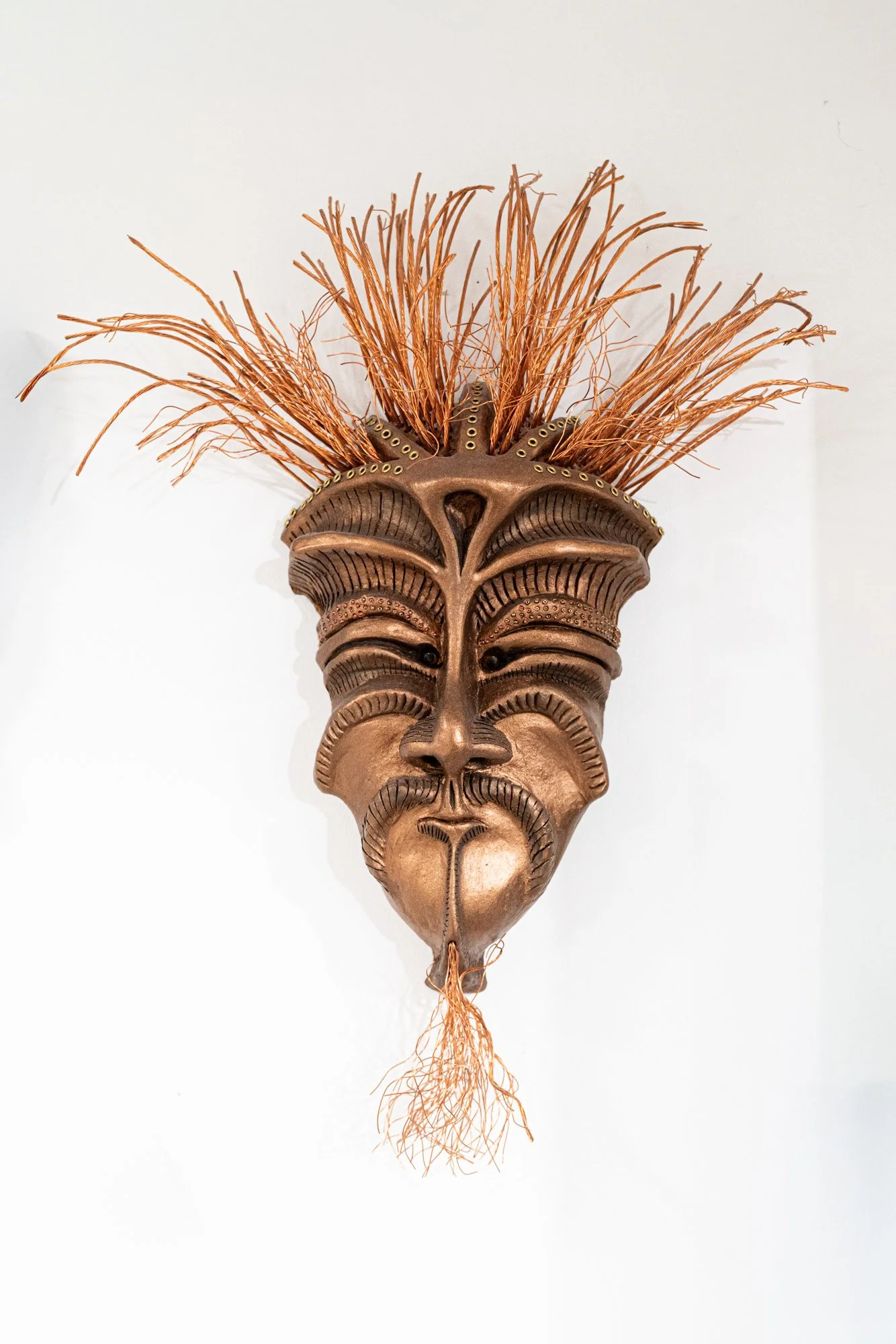 Challenger Mask - Intuitively modeled. Low fire clay, copper paint, copper wire, brass beads.16” x 10” x 5”