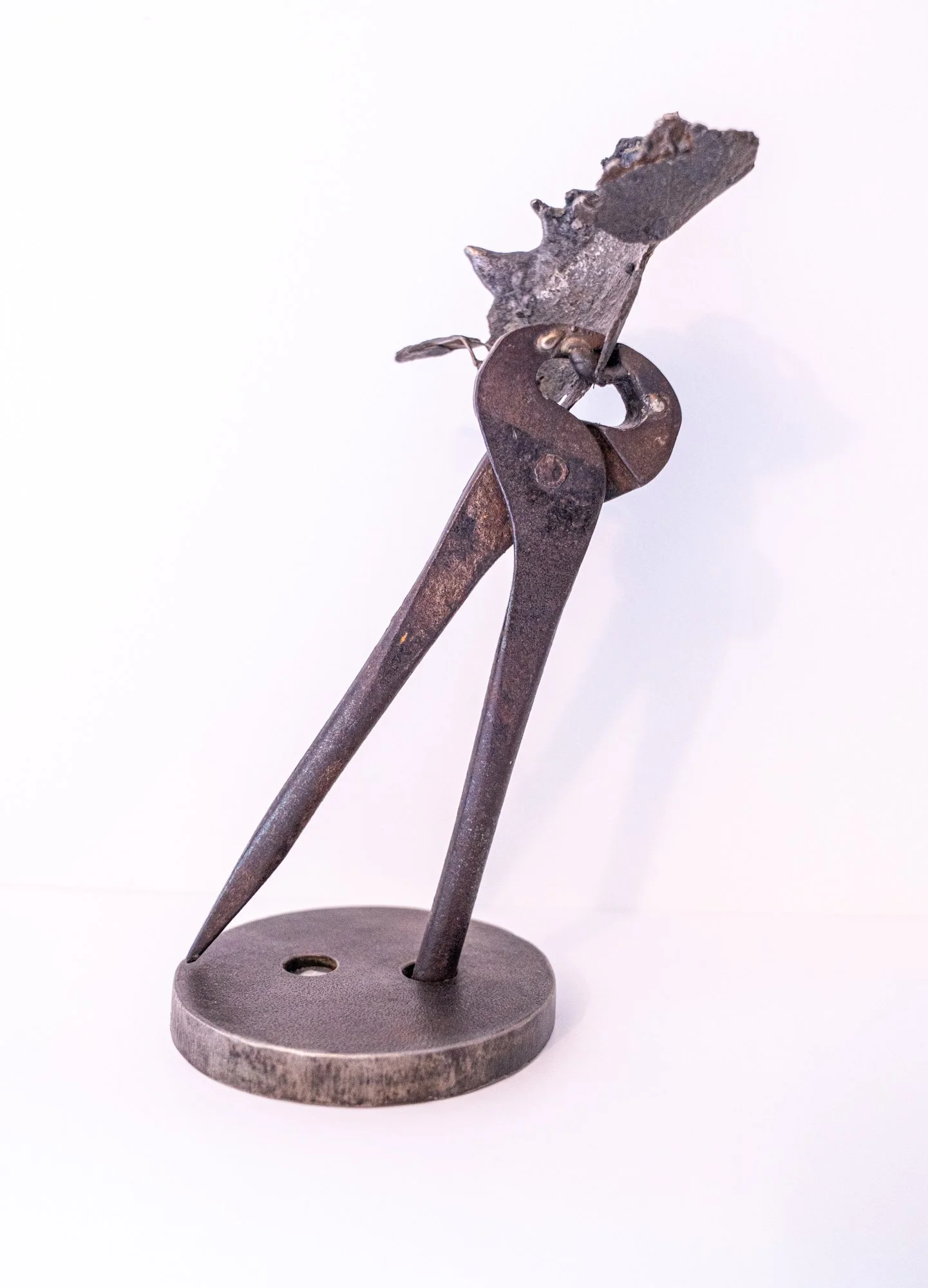 Grip -Inspired by the instructions and dialog that takes place when working together with another person. Cast stainless steel, vintage nipper tool, welded steel.  9.5” x 5.25” x 4”. 2019