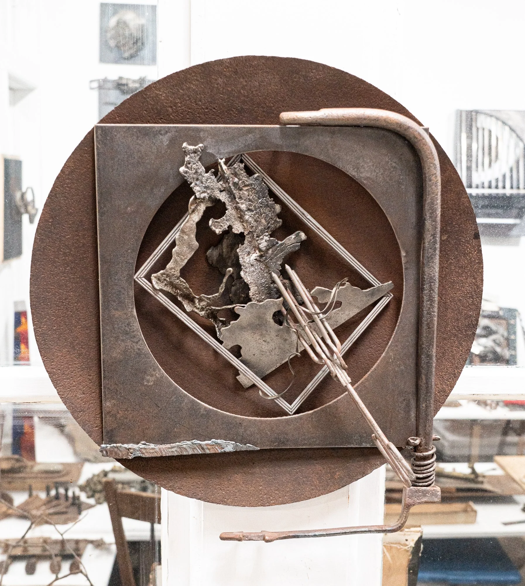 Pleated Plans - Composition inspired by the vintage pleating tool welded into this piece. Plow disc, pleating tool, cast stainless steel, welded steel. 18” x 18” x 6”. 1995