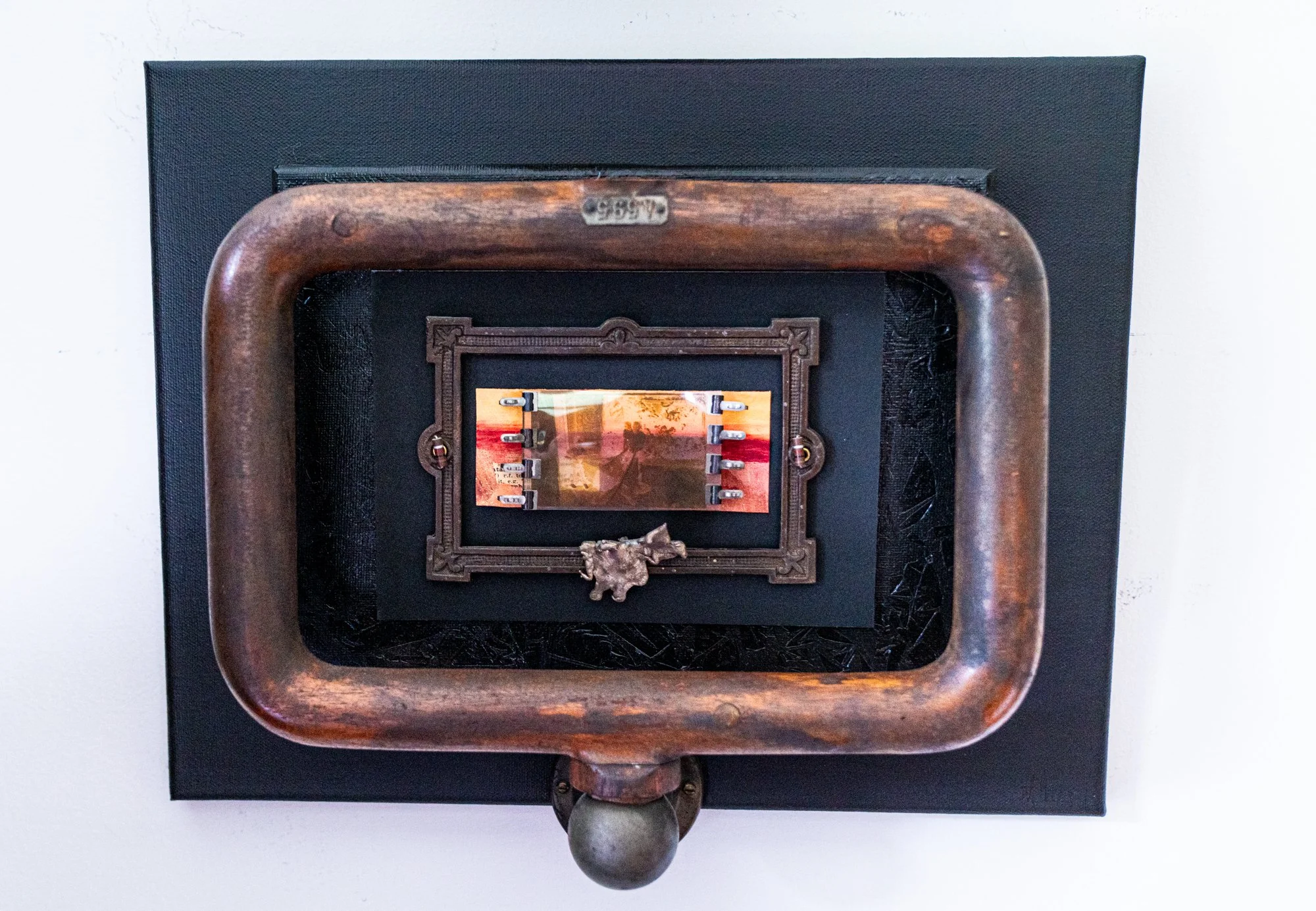 Recollection - Inspired by the act of recalling memories. Wood pattern piece, brass, bronze frame and spill, paper clips, painting, photo negative, canvass. 12” x  14” x 4”. 2011 