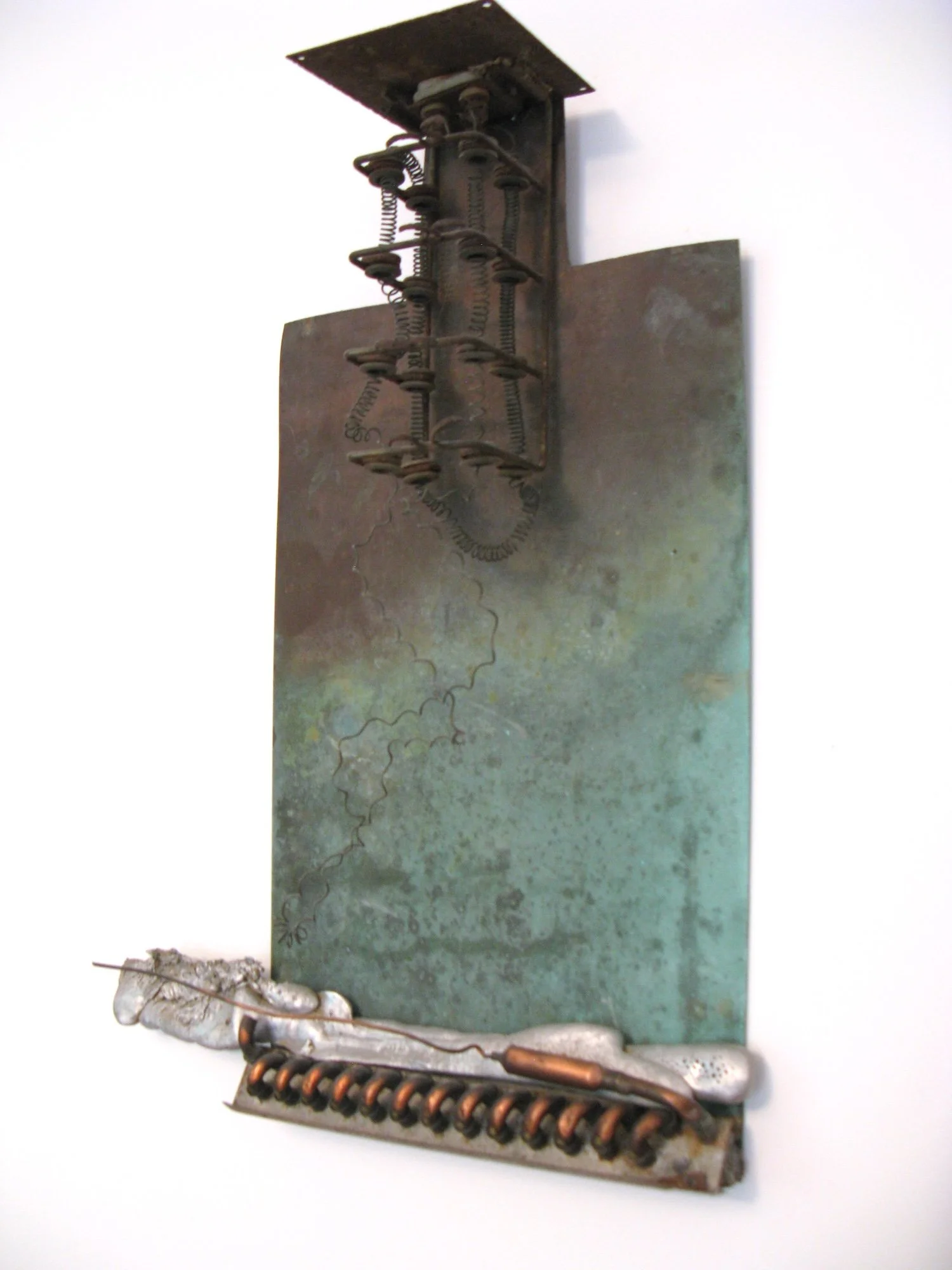 Disconnect - Inspired by the idea of breaking or severing a connection. Copper, cast aluminum, heating element, oven heating elements. 29” x 59” x 5”. 2006. ( in a private collection)
