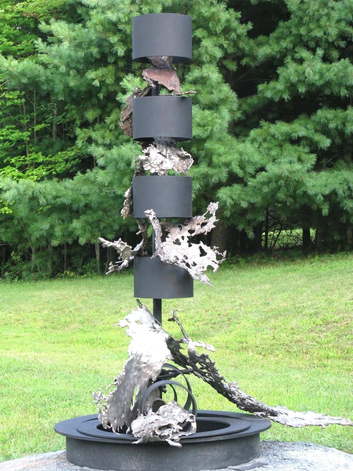 Artesian Muse - The inspiration for the work comes from a deep appreciation for water, particularly the form and motion of waterfalls. Cast stainless and mild steel. 88” x 77” x 66” 1995