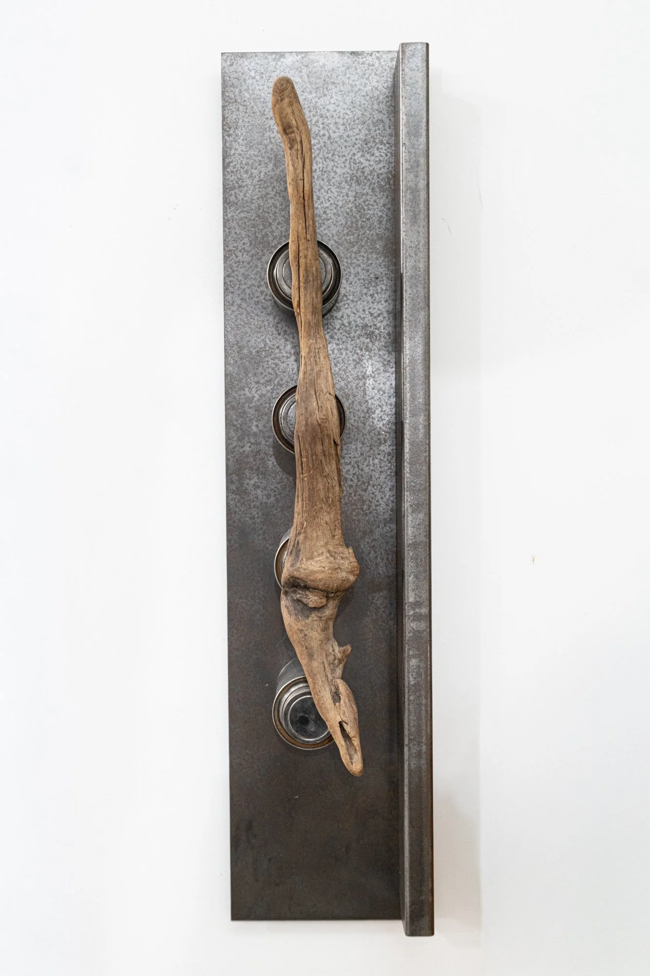 Natural Process - Inspired by the products being produced without chemical additives. Welded steel, drift wood, vintage cans. 31” x 7” x 7”. 2006