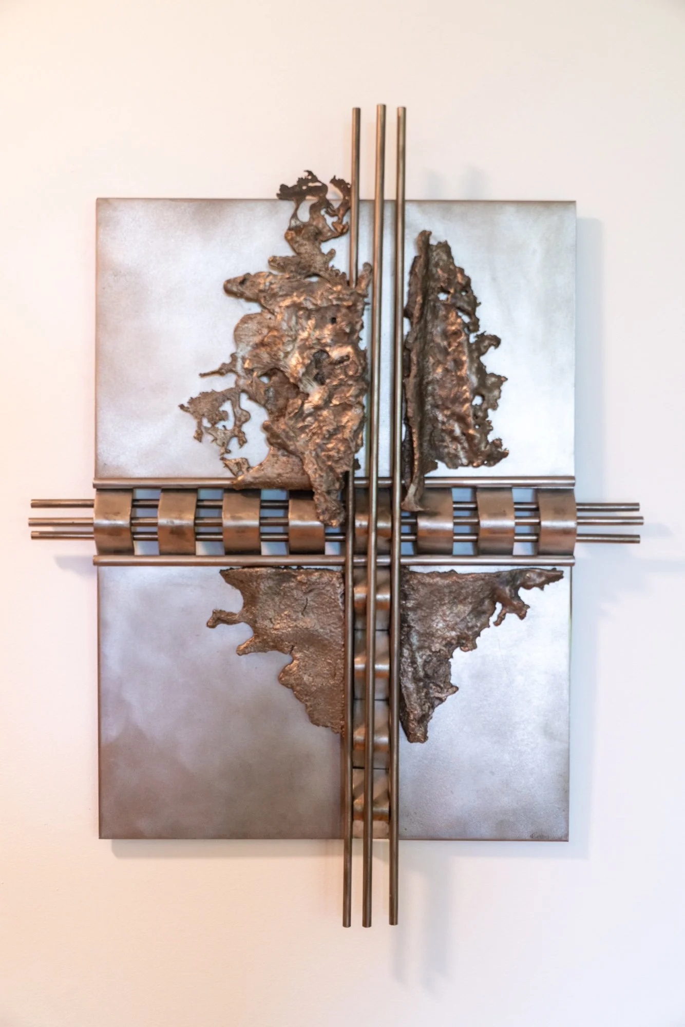 Crosscut - Inspired by the idea of going against the grain. Cast and welded stainless steel. 21” x 24” x 6”. 1989