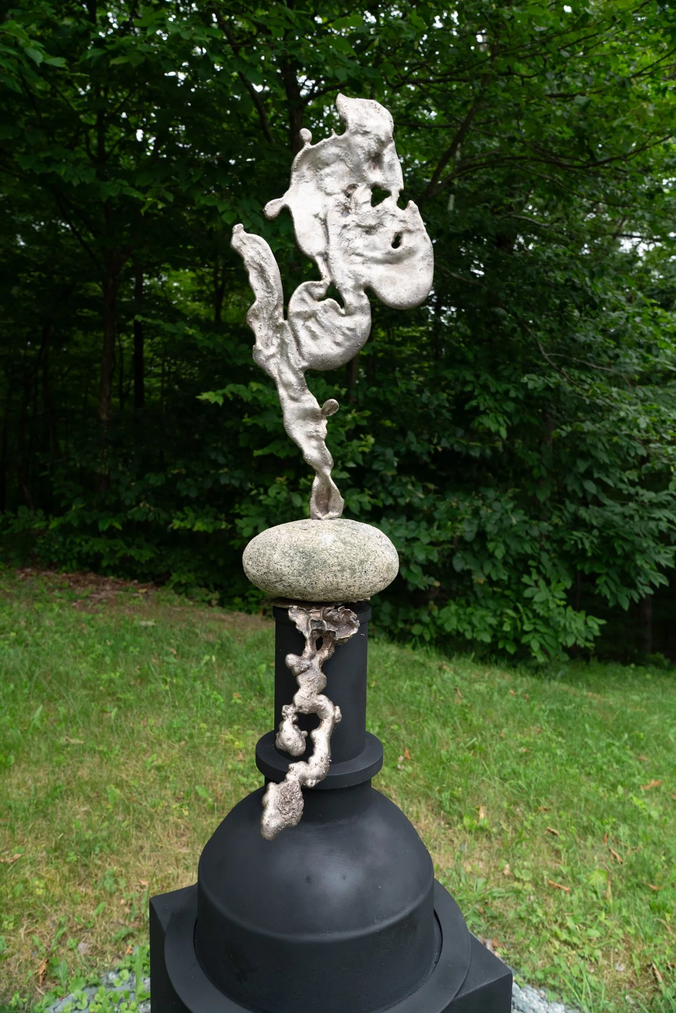 Pandora’s Box - Inspired by Greek mythology where a vessel is opened releasing evil, while trapping hope inside.Cast stainless steel and welded steel. 64” x 15.25” x 15.25”. 1999