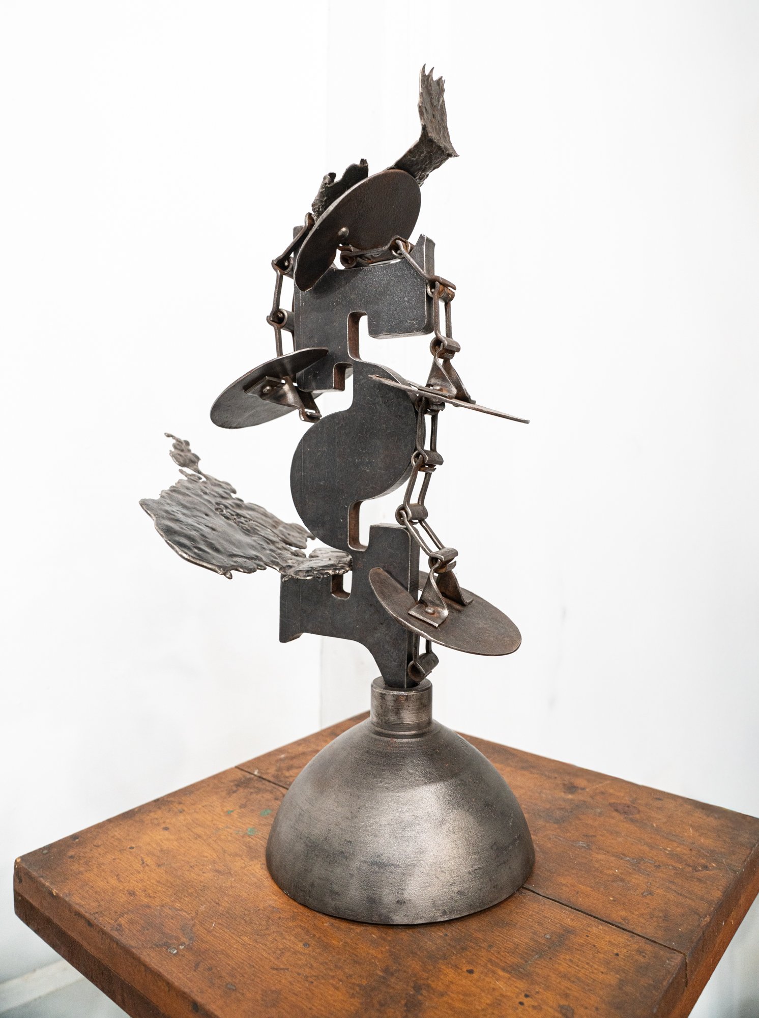 Cascade - The concept of a series of stages where each stage triggers the next. Vintage paddle conveyer, tank top, steel, cast stainless steel. 24.25” x 14” x 8”. 2021