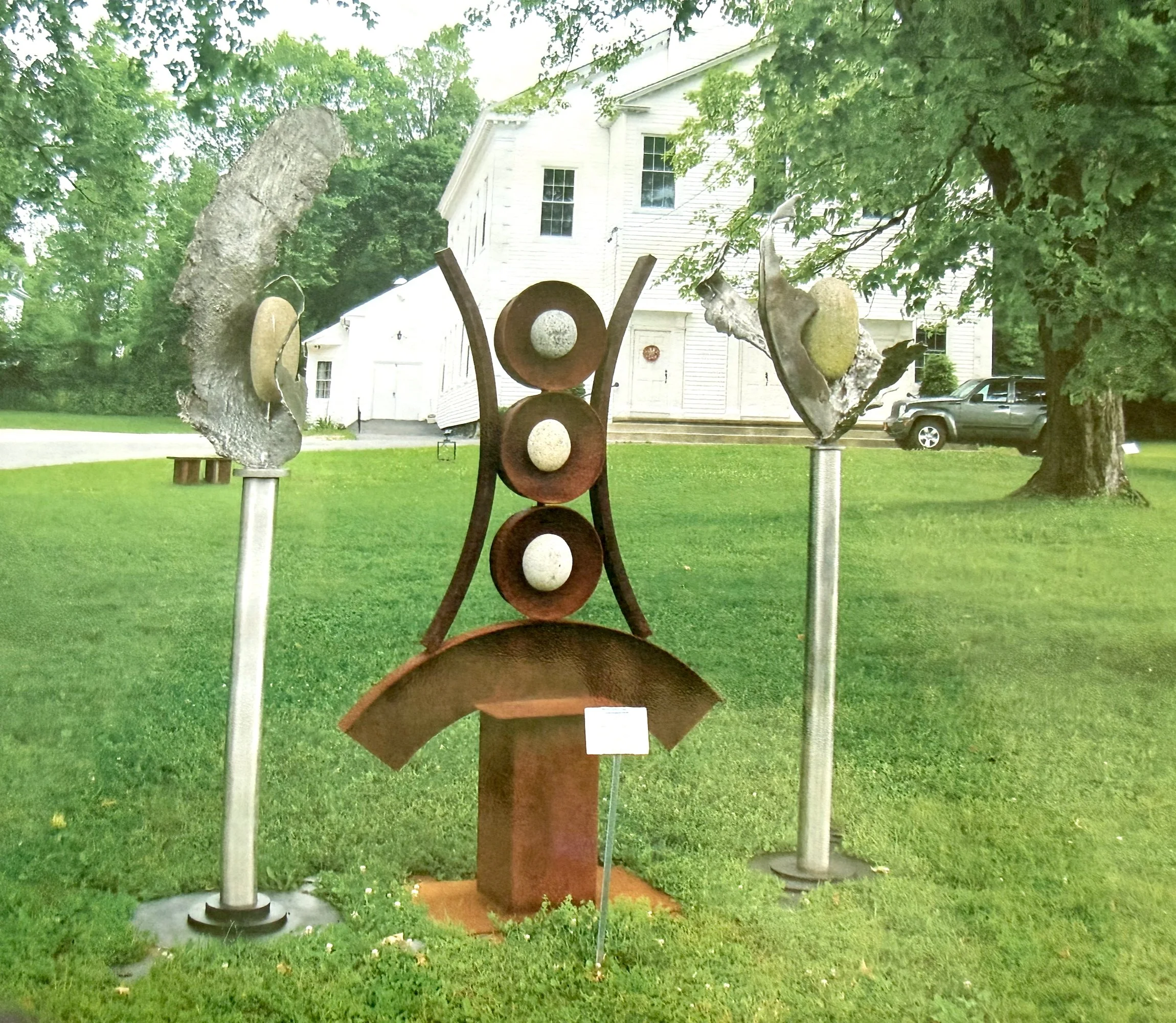 Artifacts I - Inspired by the industrial cast stainless steel forms from a local defunct steel manufacturing plant that serve as artifacts from that time period. Welded steel, cast stainless steel, rocks. Overall 9’ x 11’ x 3’.  2009