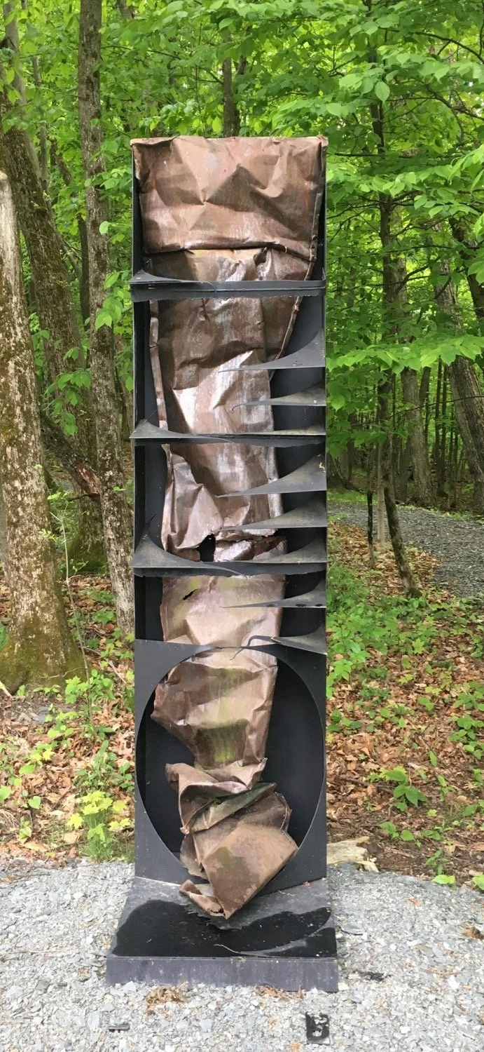 Under the Influence - Inspired by the impairment created by alcohol and drugs. Welded steel, tin roofing. 10’ x 2’ x 3’. 1995