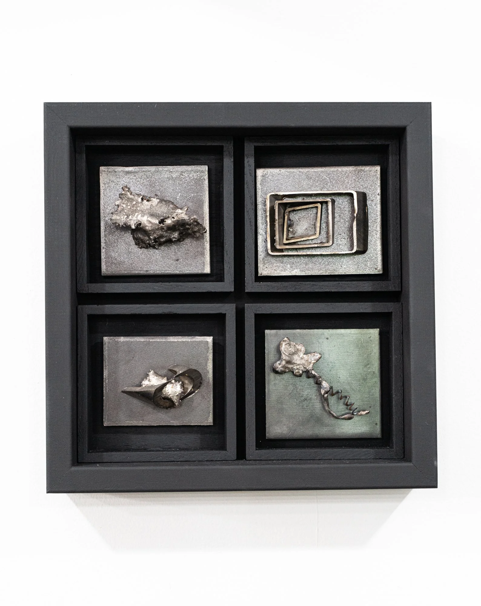 Stages - Inspired by stages of development. Four welded steel plates. 12” x 12” x 2”. 2025
