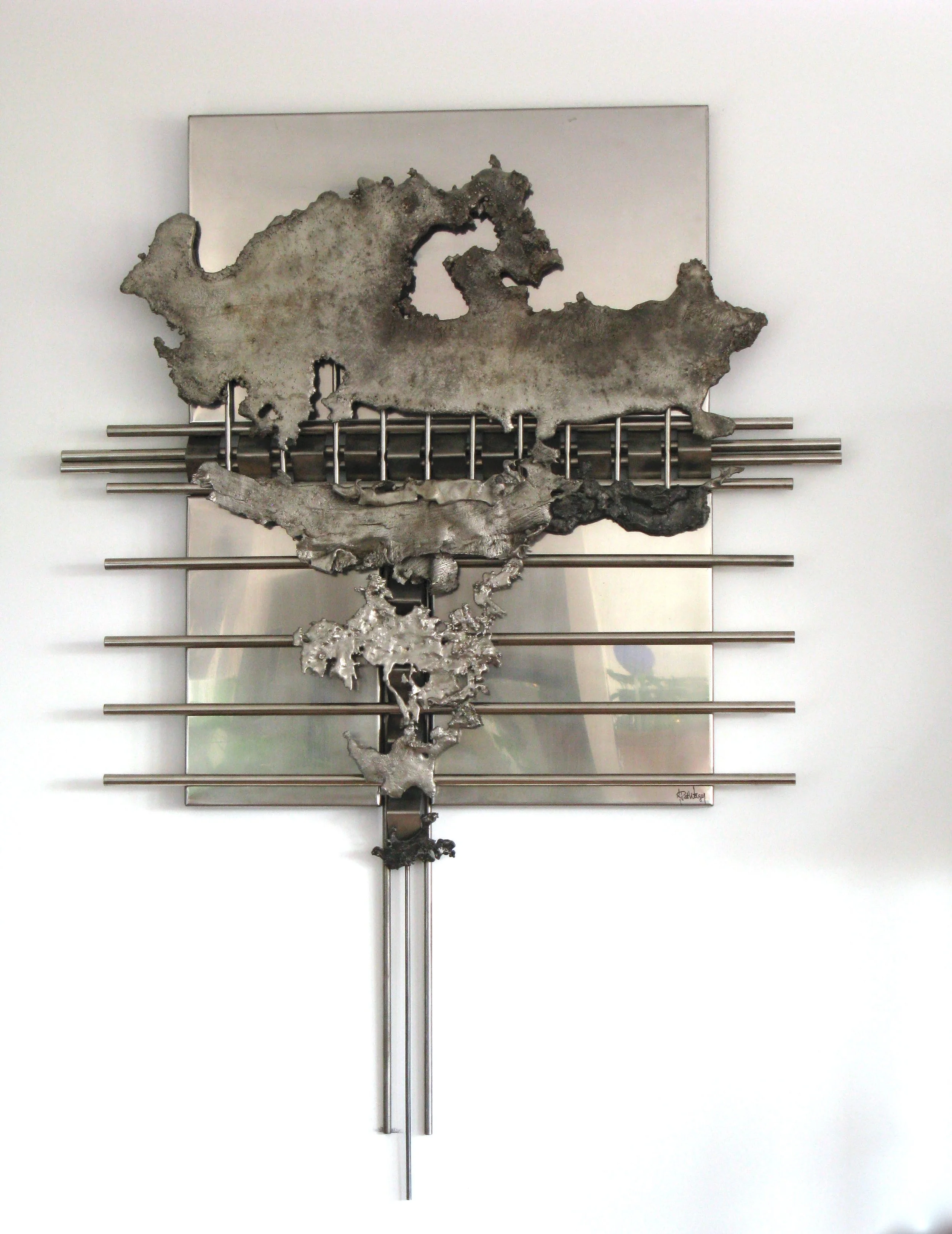 Eruption - Inspired by the idea of a sudden, violent outburst, or  explosion. 5’5” x 4’ x 5”. Cast & welded stainless steel. 1989