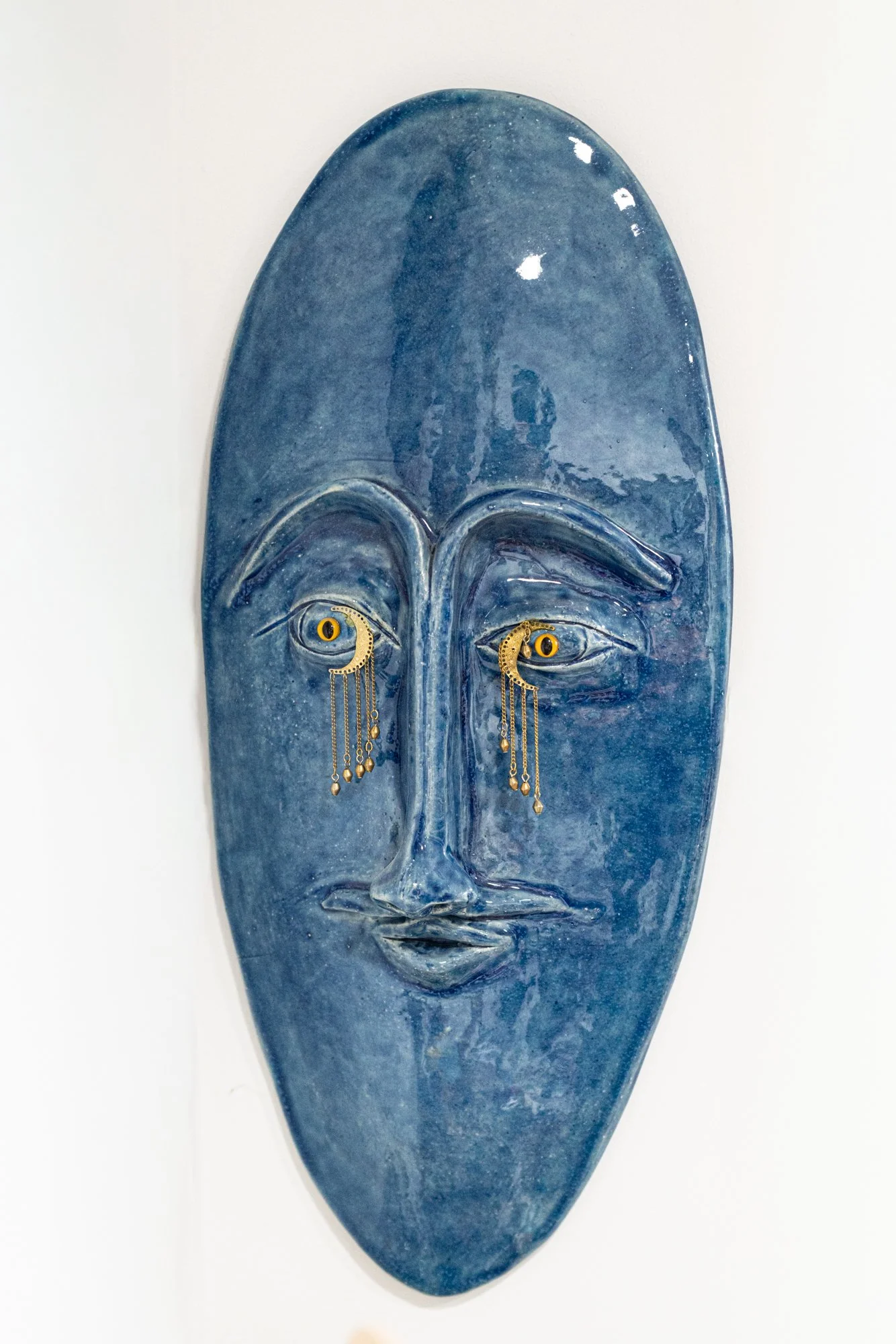 Blue Moon Mask - Intuitively created. Modeled clay adorned with brass jewelry  22” x 6” x 2”