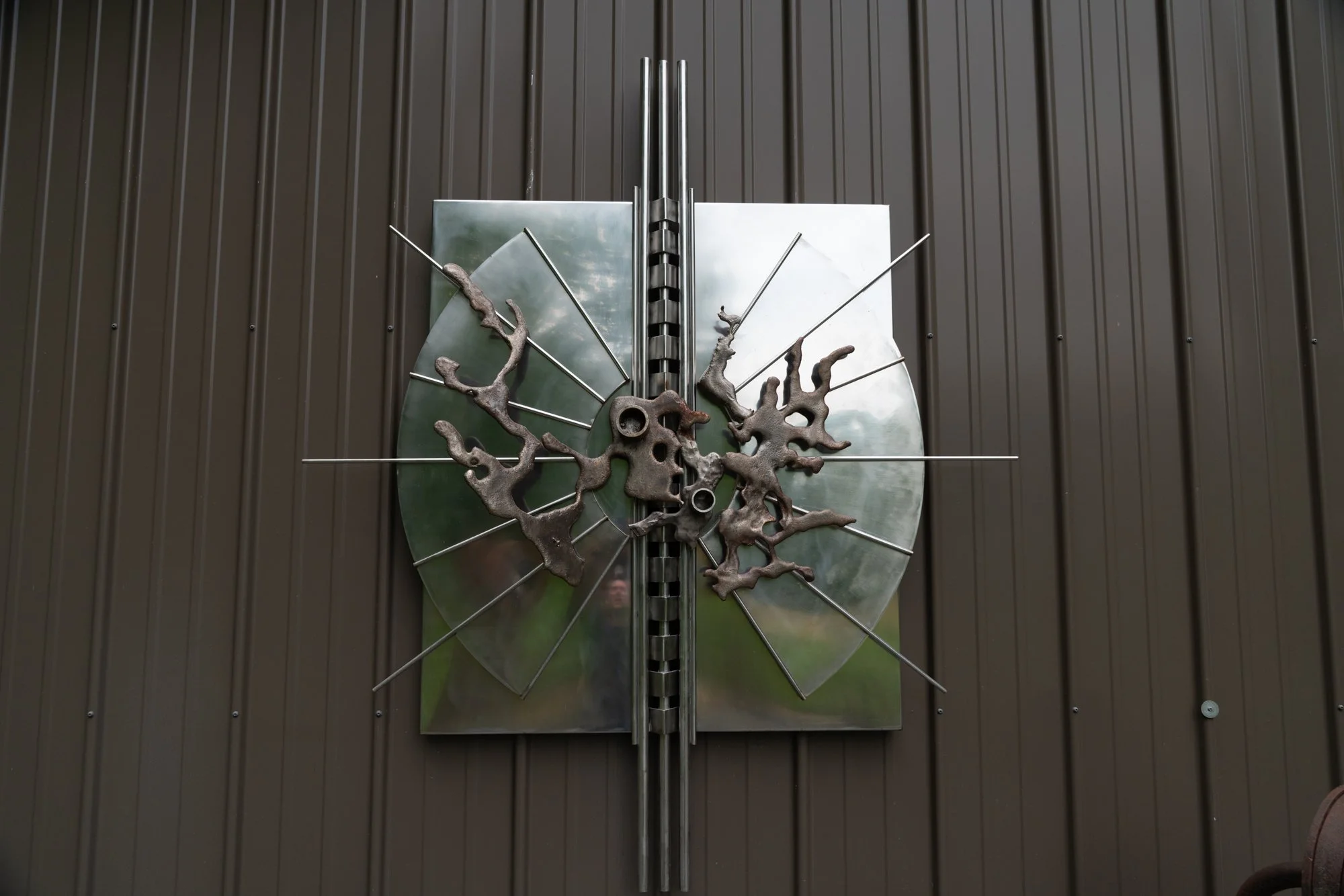 Visionary Burst - Inspired by an intense surge of innovation or creative insight. Welded stainless steel. 6’ x 5’ x 8” 1987
