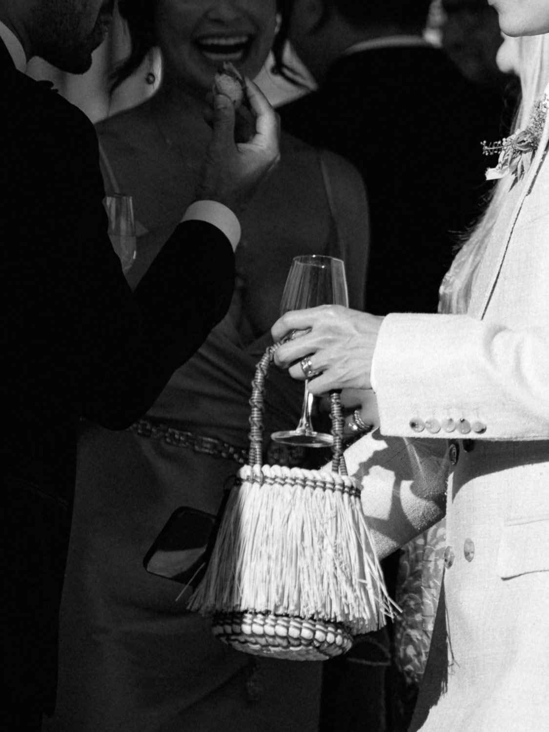 Joyful couple laughing and enjoying the cocktail hour, capturing a moment of carefree elegance and celebration