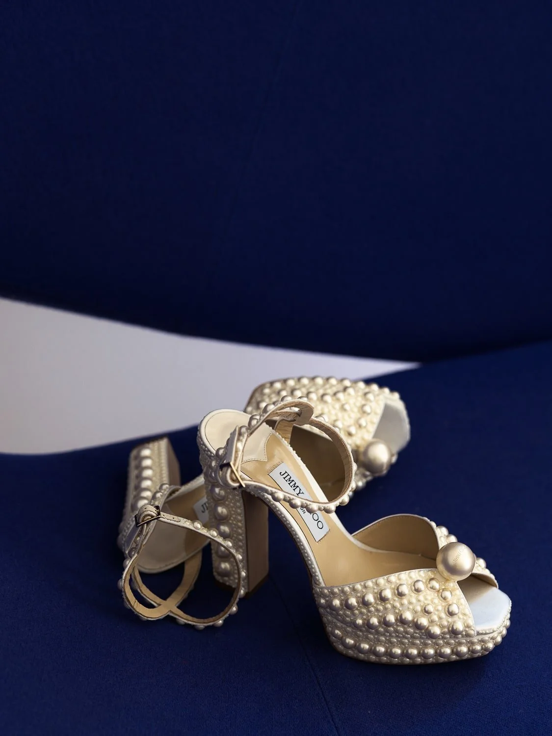 Elegant Jimmy Choo bridal shoes, adorned with sparkling details, perfect for adding a touch of luxury and sophistication to a timeless wedding look