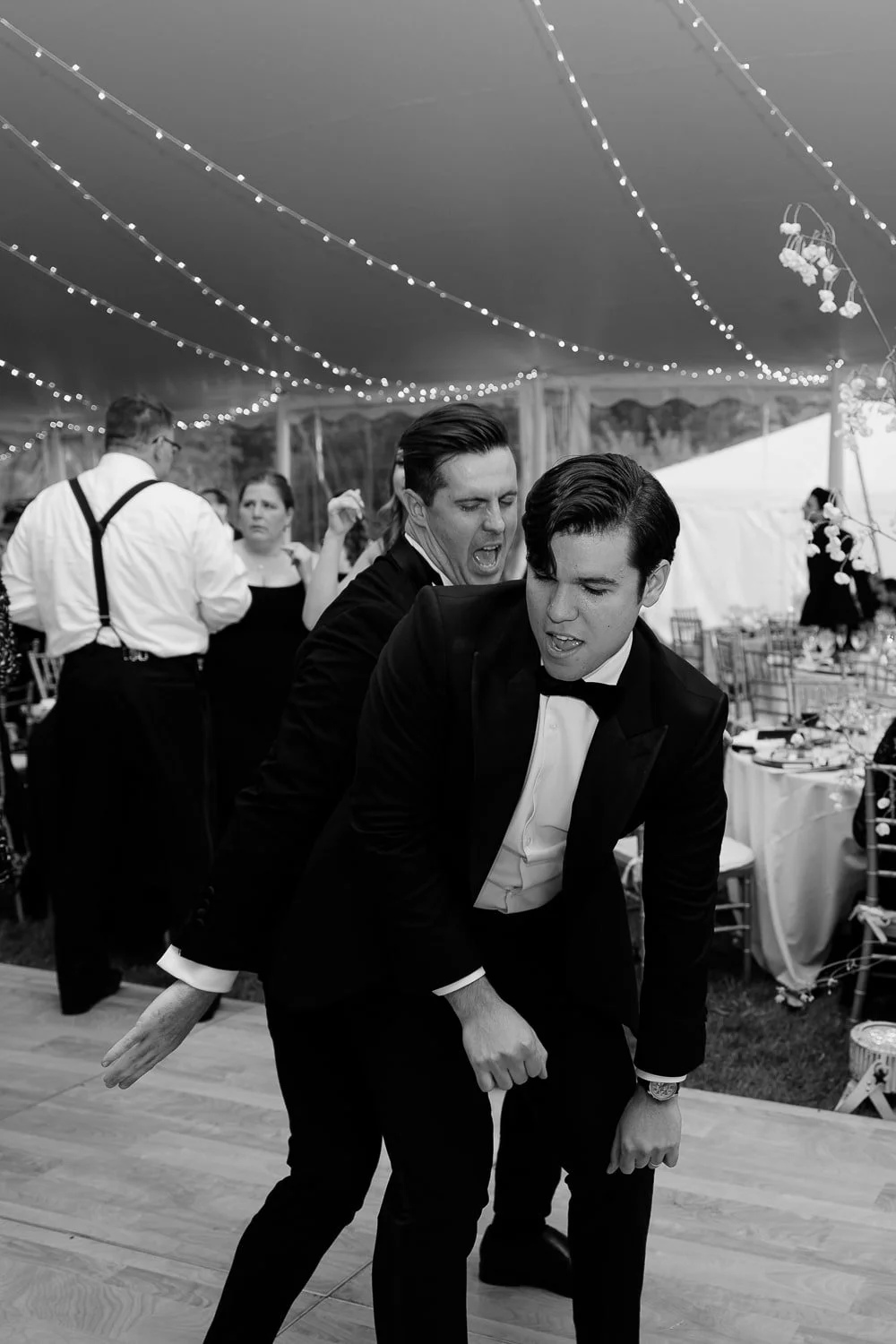 he groom dancing on the dance floor, capturing a joyful and dynamic moment of celebration