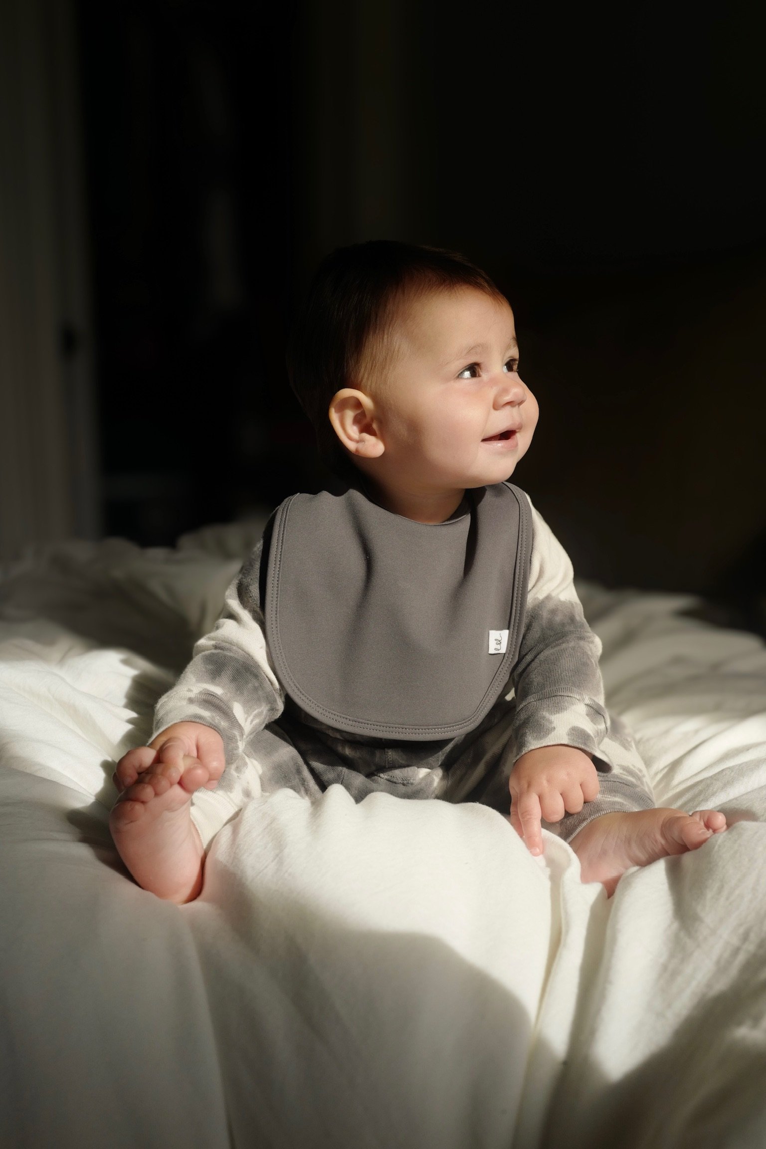 Baby wearing Leya & Lior SnapDry bib