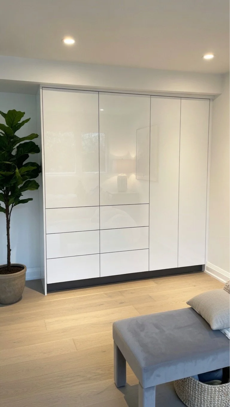 creating a custom made closet and drawers in the bedroom to maximize the storage space and drastically improve the look and save in space.