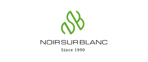 Logo for Noir Sur Blanc with stylized 'N' and 'B' letters and the text 'Since 1930'