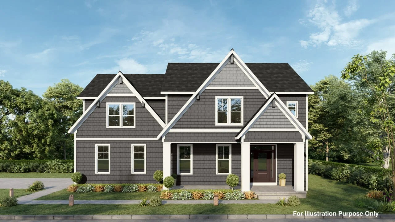 Front view of a modern two-story house with dark gray siding, multiple gabled roofs, and white trim, surrounded by green trees and a landscaped lawn.