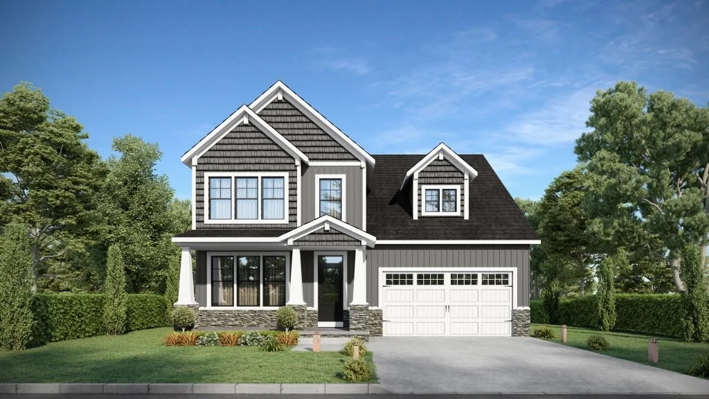 A two-story house with gray siding, white trim, a black roof, and a front porch with white columns. There is a driveway leading to a two-car garage on the right, surrounded by green lawns and trees.