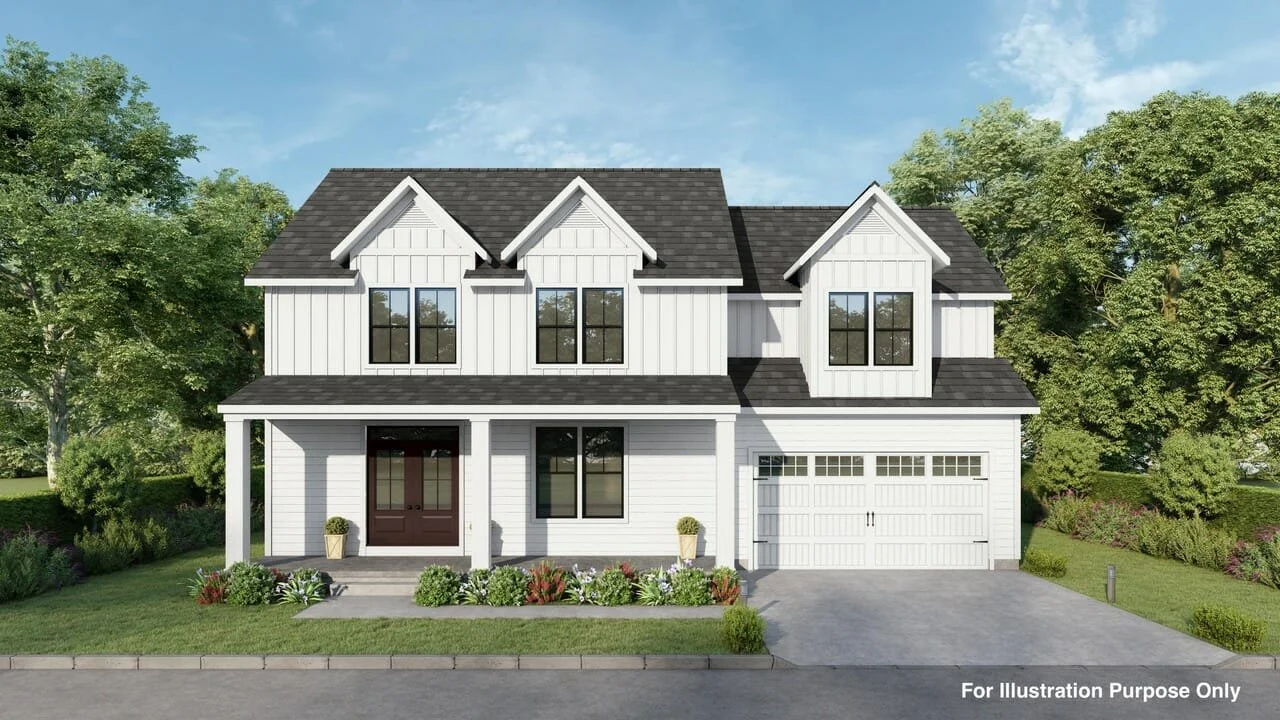 Front view of a two-story white house with dark roof, black window frames, and a garage, surrounded by green trees and landscaped yard.