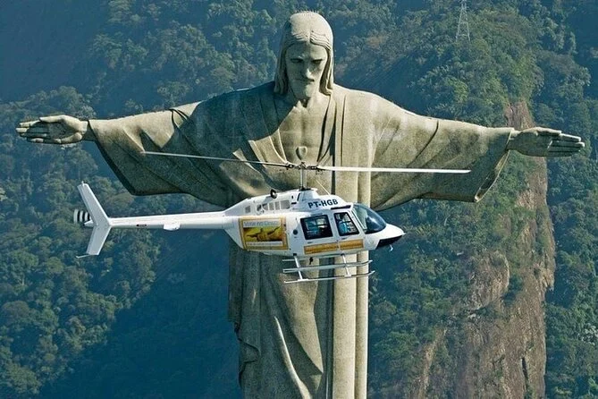 A helicopter flying in front of the Christ the Redeemer statue overlooking Rio de Janeiro, Brazil.