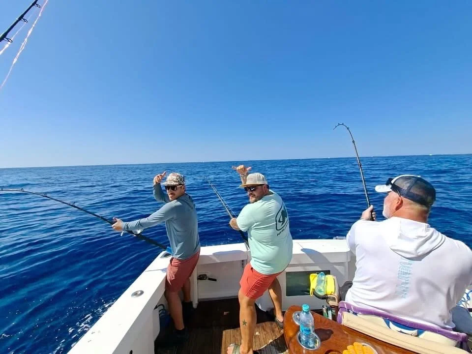 Triple marlin hook up for this group of friends deep sea fishing on the Reel Cast in Cabo