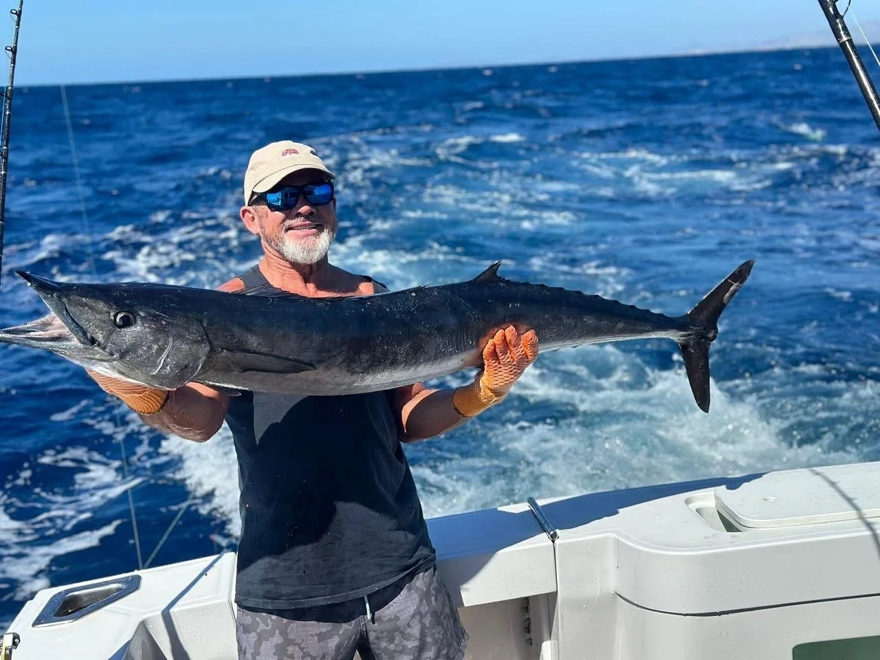 Fisherman shows off big wahoo caught deep sea fishing in Cabo San Lucas