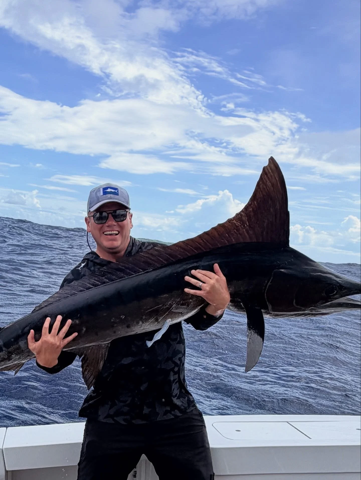 Fisherman shows off his marlin caught in Cabo San Lucas