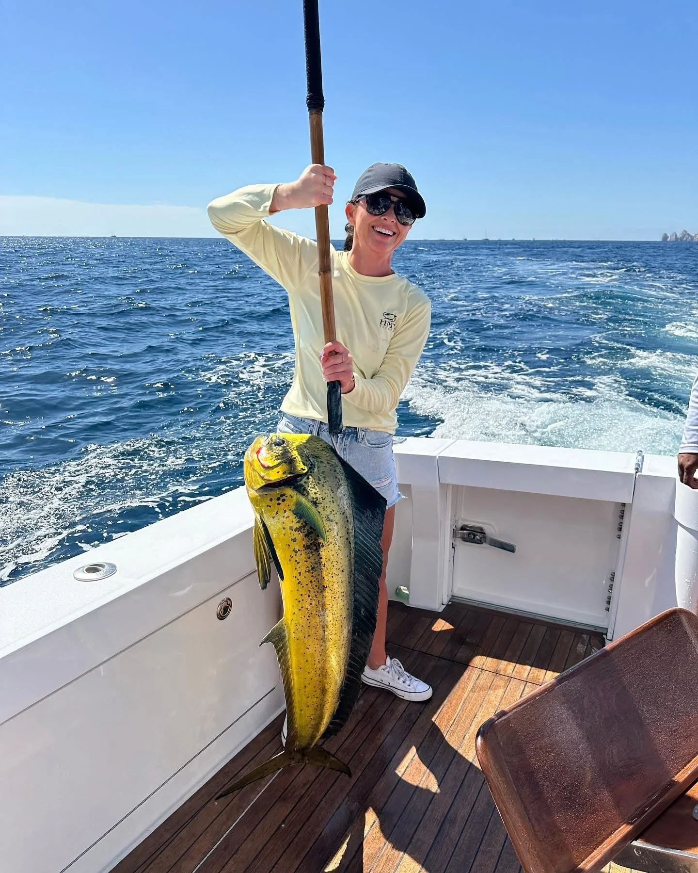 Female angler shows off nice mahi mahi caught offshore in Cabo