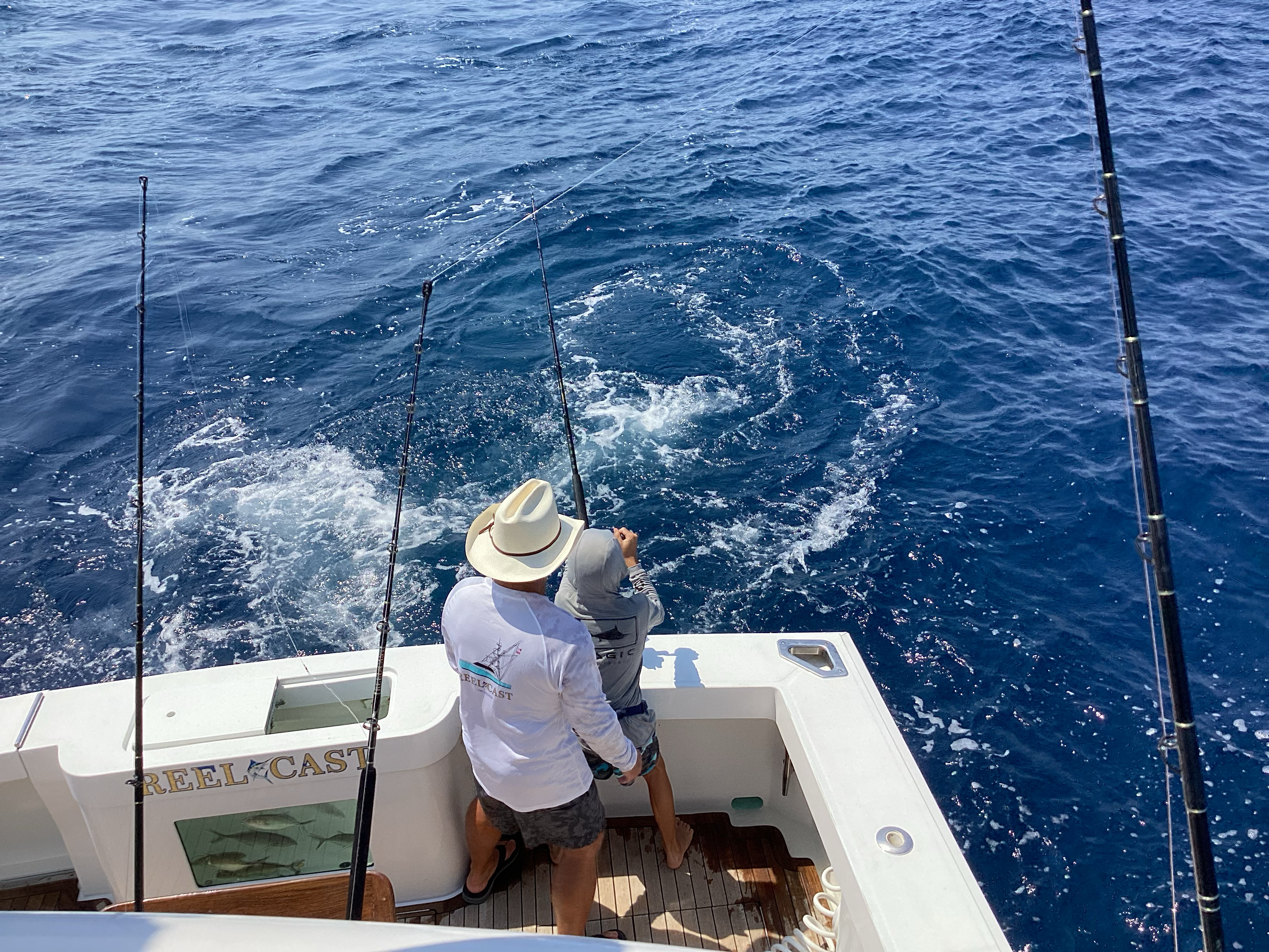 Grandfather and grandson fishing together in Cabo San Lucas