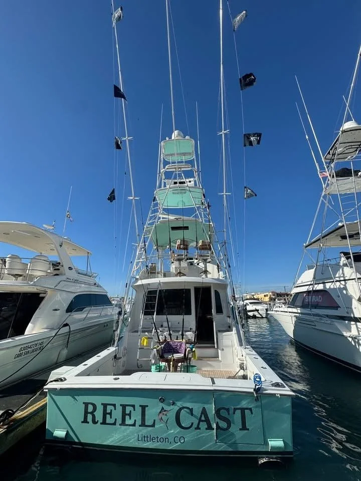 Rear view of the sport fishing boat Reel Cast docked at the marina in Cabo San Lucas