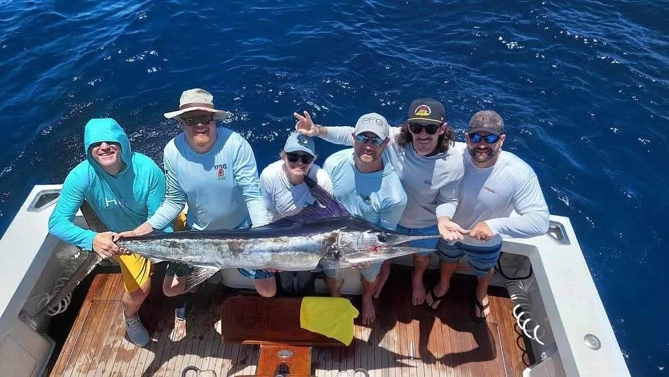 Group of fishermen show off their marlin catch on the Reel Cast in Cabo San Lucas