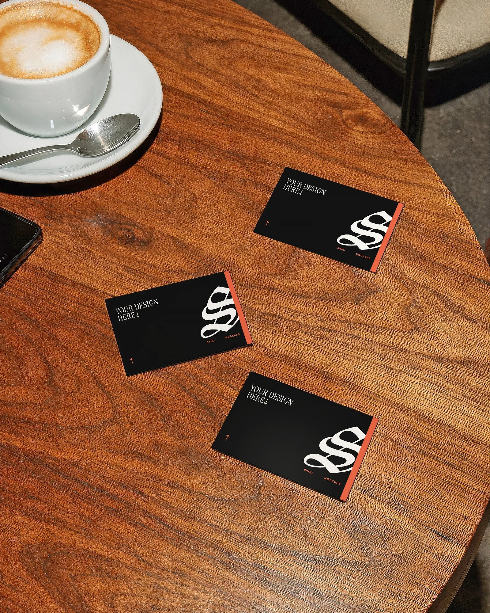 Scattered Business Cards on Walnut Table