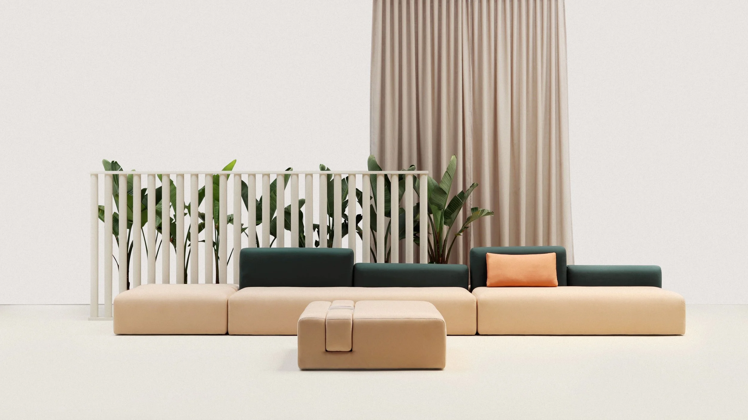 Modern minimalist living room with beige and dark green sofas, a beige ottoman, green plants, a white slatted divider, beige curtains, and a white wall.