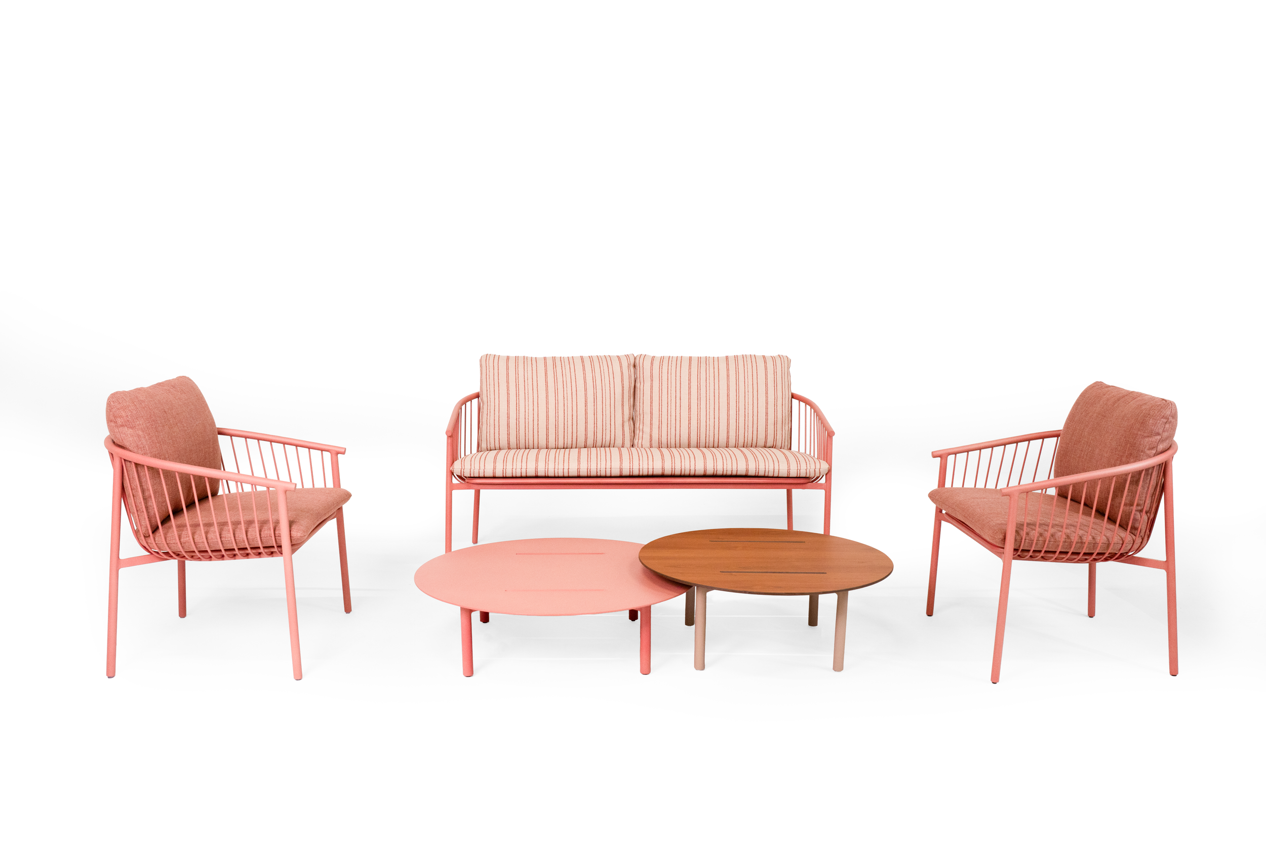 Pink outdoor furniture set with two armchairs, a loveseat, and three round coffee tables in pink and brown, on a white background.