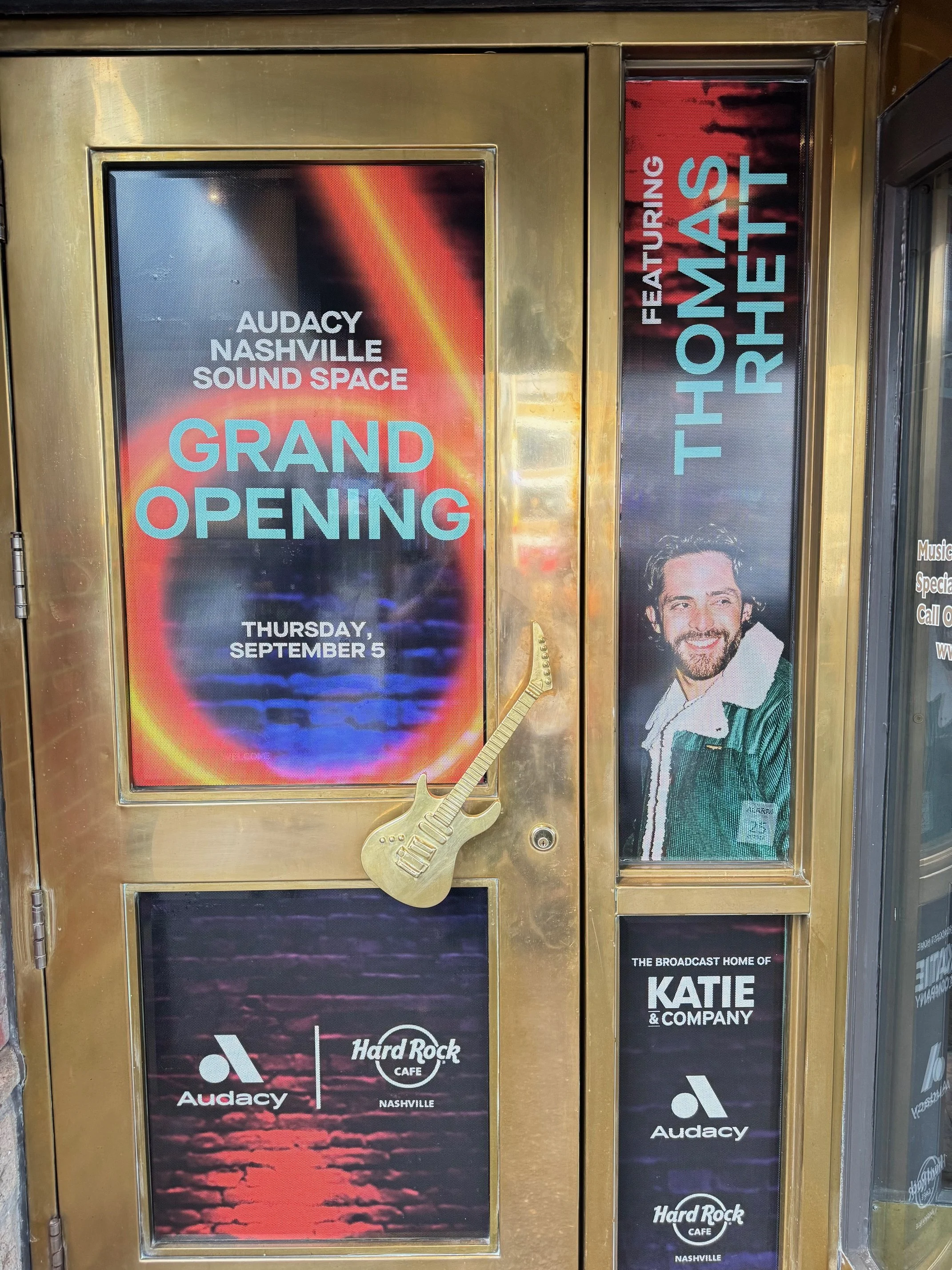 Sign announcing the grand opening of Audacy Nashville Sound Space on September 5, with a promotional image of Thom Rhet, and logos of Audacy and Hard Rock Cafe Nashville.