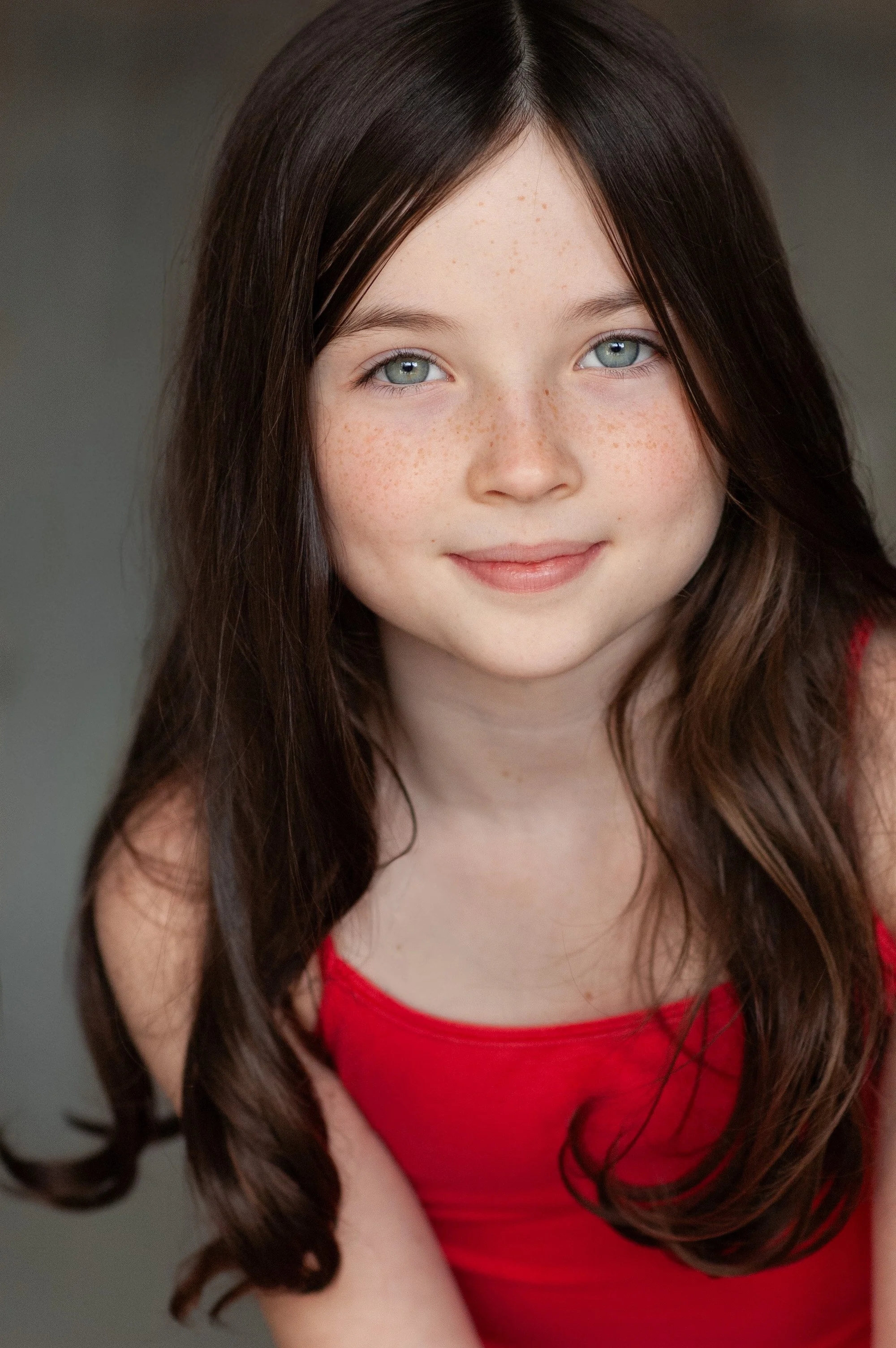 Youth headshot with long hair and red dress in natural light Seattle Washington portrait photographer