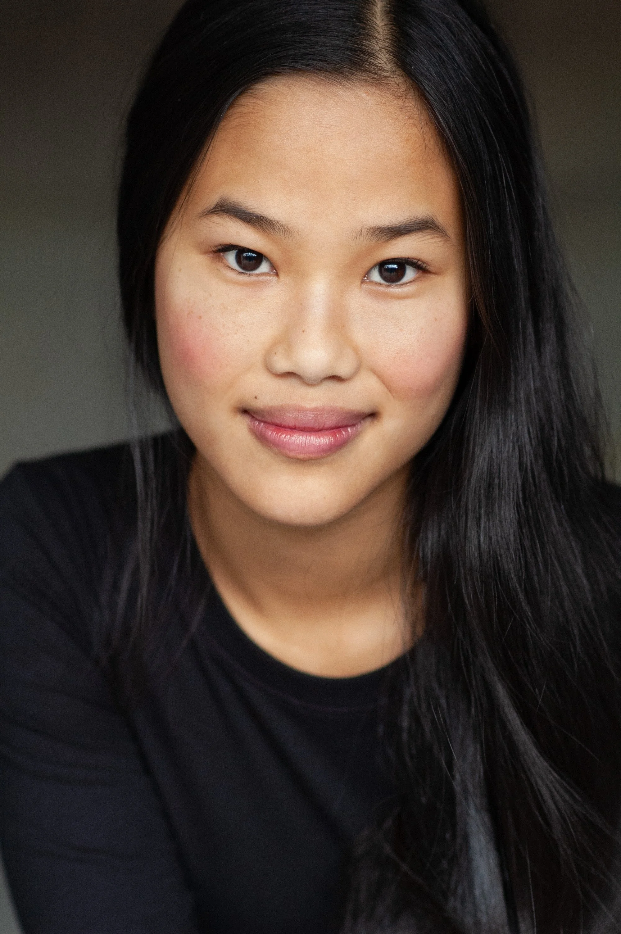 Professional headshot of woman with clean background and soft lighting Seattle Washington photographer