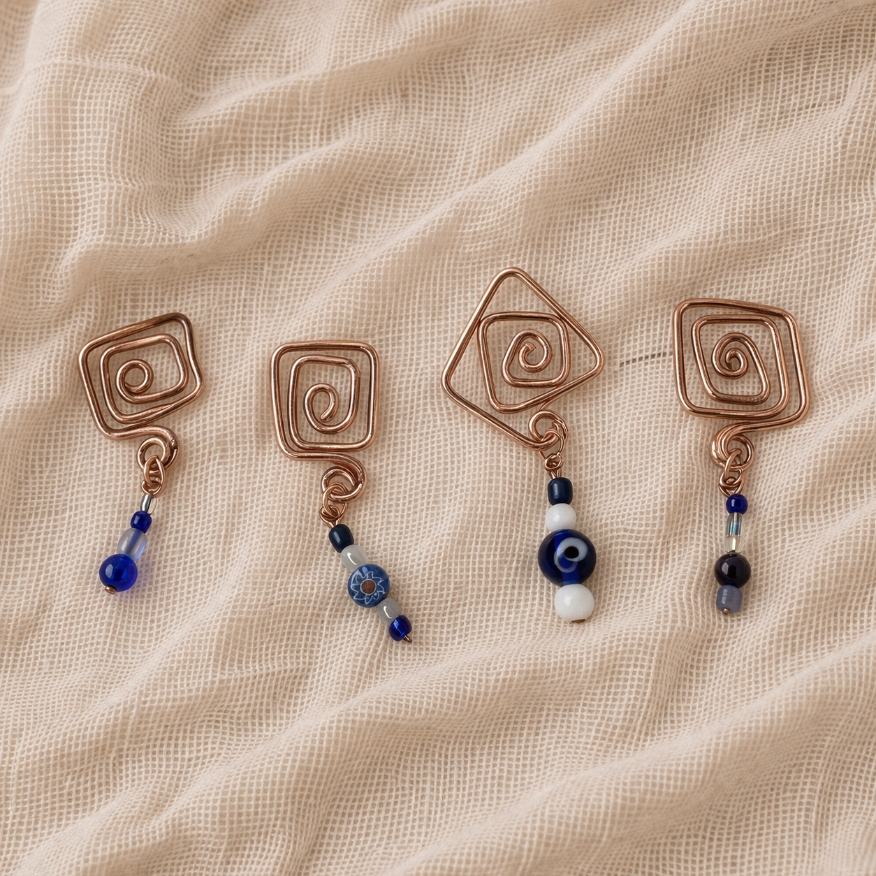 Artisanal copper and bead pendants.png