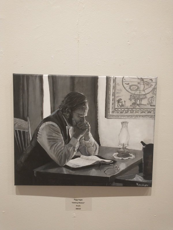A grayscale painting of a person sitting at a table, reading a book and appearing deep in thought with hands clasped near their mouth, in a room with a tapestry on the wall and a glass oil lamp on the table.