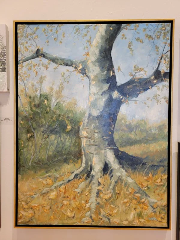 A painting of a large tree with a thick trunk and sprawling branches in an autumn setting, with fallen leaves on the ground and a bright sky in the background.