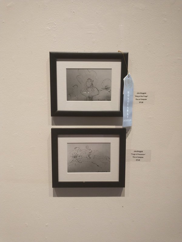 Two framed sketches by John Bruggink titled 'King of the Fishes' and 'Frog in Preparation,' displayed on a white wall with a blue ribbon indicating honorable mention.