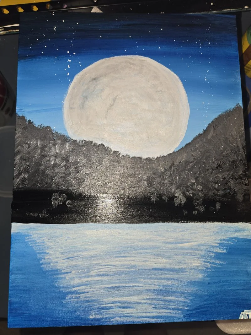 Painting of a full moon over a mountain landscape reflecting on a body of water at night.
